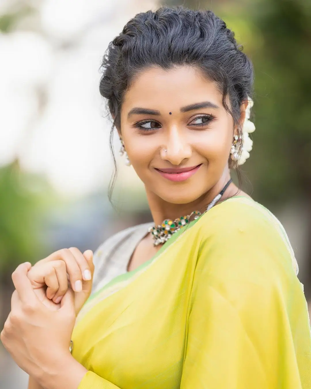 priya bhavani shankar wearing beautiful earrings jewellery green saree